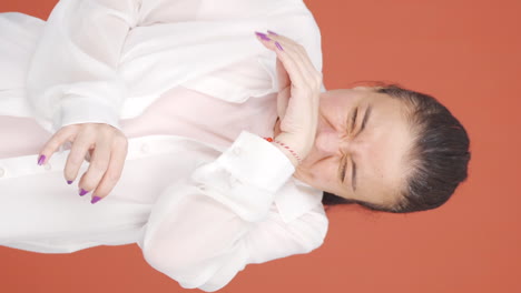 Vertical-video-of-The-sneezing-woman.-Patient.